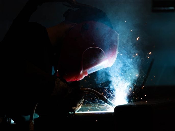 MIG welding steel at MorFab's fabrication workshop